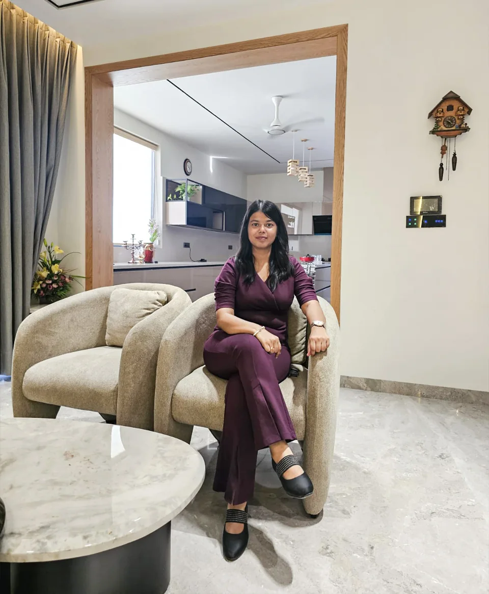Diya Jindal, principal designer and Vastu consultant at DDesignSpace, seated in a completed apartment interior
